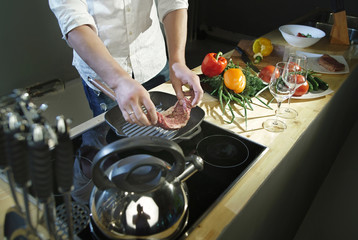 Cooking meat in a flying pan