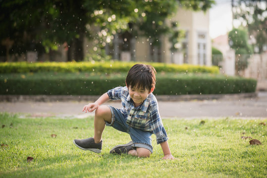 Cute Asian child playing in the park