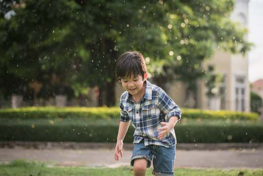 Cute Asian child playing in the park