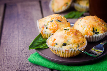 Muffins with Spinach and Cheese on Wooden Table Background. Healthy Breakfast Food Concept. Copy Space