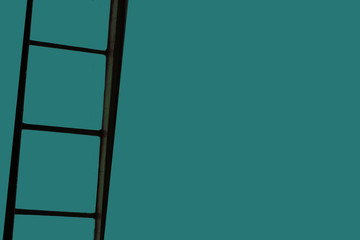 ladder on green background,try to climb on ladder
