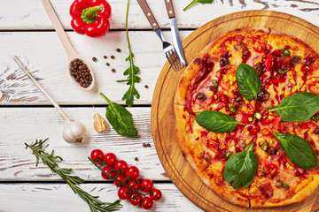Delicious pizza on wooden table.