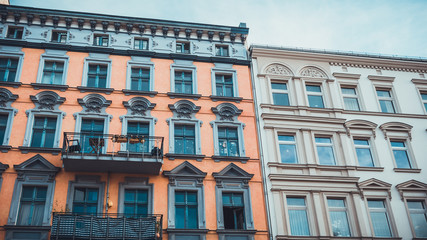 orange and white facaded buildings