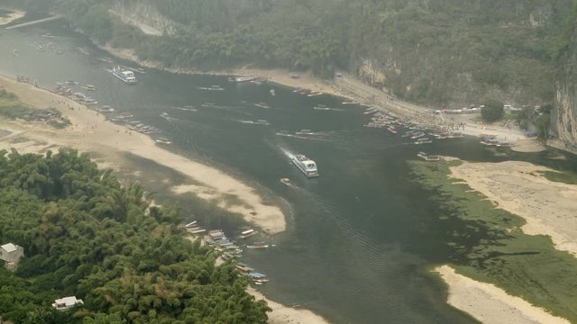 Time lapse of Tour boat and Tourist rafts are sailing over the Li river.
