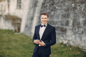 groom in a black suit