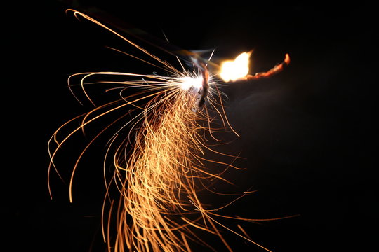 Abstract Texture Background of Fire Sparks With Motion Blur Effect Over Black Background. Slow Shutter