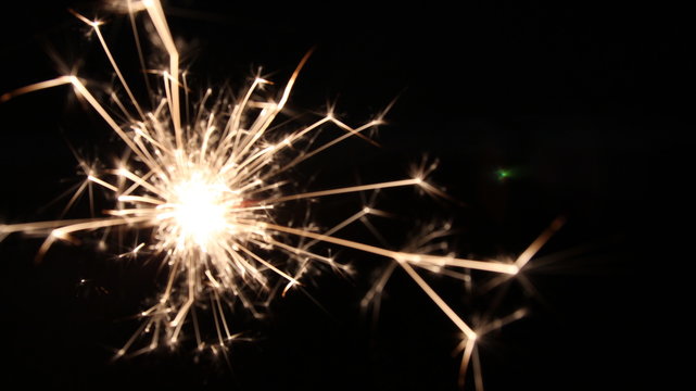 Abstract Texture Background of Fire Sparks With Motion Blur Effect Over Black Background. Slow Shutter