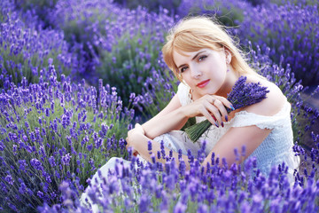 woman sitting at lavender field