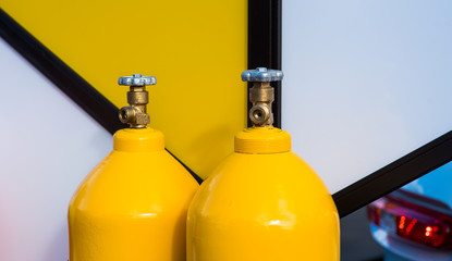 yellow LPG gas bottles