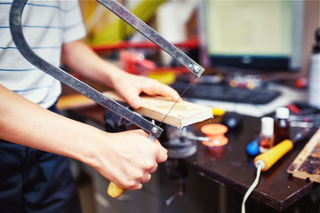 Child in the workshop working tool