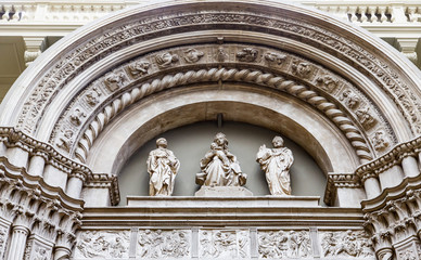 Fototapeta na wymiar Three Statues on Church Arch
