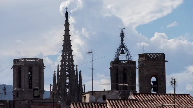 timelapse shot of the rooftops of barcelona shot from a terrace in the centre of the city. the weather this day was a mix of sun and storms creating interesting and beautiful skies