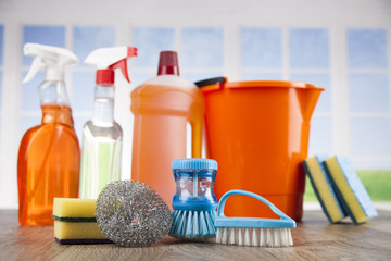 Close up of cleaning supplies and equipment and window background