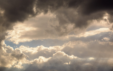 a big and fluffy cumulonimbus cloud in the blue sky