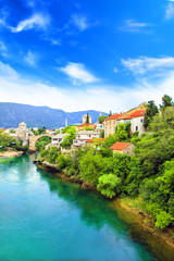 Fototapeta na wymiar Beautiful view Old bridge in Mostar on the Neretva river, Bosnia and Herzegovina, on a sunny day