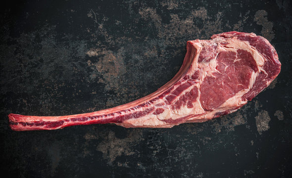 Dry aged raw tomahawk beef steak