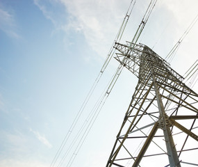 Power line bottom view with blue sky in the background