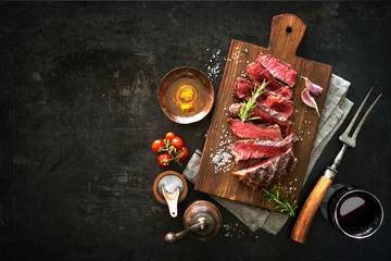Gardinen Sliced medium rare grilled beef ribeye steak © Alexander Raths
