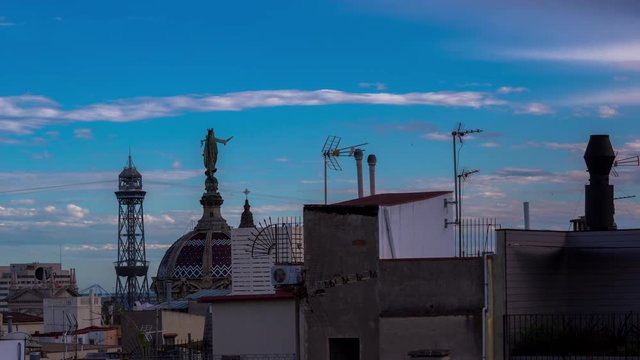 timelapse shot of the rooftops of barcelona shot from a terrace in the centre of the city. the weather this day was a mix of sun and storms creating interesting and beautiful skies