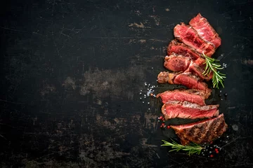 Foto auf Acrylglas Sliced medium rare grilled beef ribeye steak © Alexander Raths