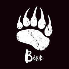 A trace a bear. White silhouette of paw on a black background. Vector. The imprint of a bear s foot. Logo of the footprint. © radionastya