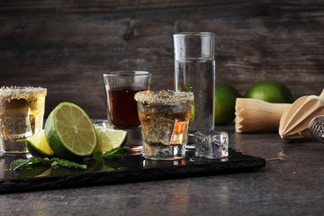 Selection of alcoholic drinks on rustic stone plate