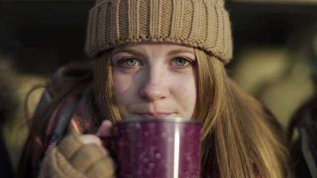 Closeup Of Teen Girl, She Smiles, Then Takes A Sip Of Hot Cocoa, Smiles Again