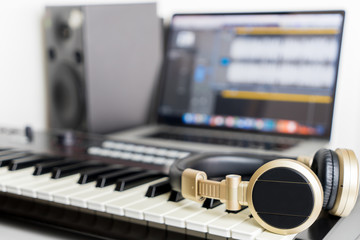 Home Music computer studio with golden headphone
