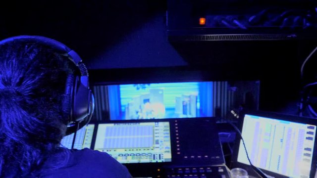 Operator in control room of a theater in a show 5