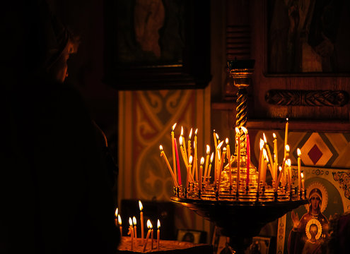 Praing woman in the orthodox church tample near the altar