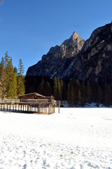 winter scenery of frozen lake Braies at Dolomites alps, Italy