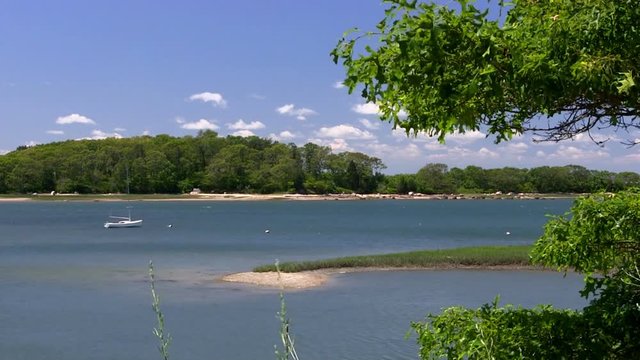 A boat moored in lagoon at Toby's island and Bennets neck on Cape Cod
