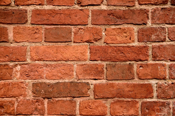 Fototapeta premium Old red brick wall background. Ancient brick texture.