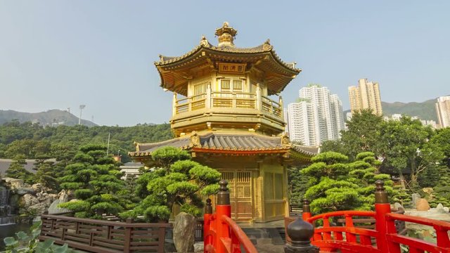 Red Wooden Arch Bridge and Golden Pavilion - Time Lapse of arch bridge and pavilion in Nan Lian Garden, Hong Kong.
