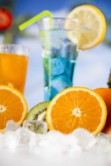 Fresh tropical fruits, Summer drink and palm branch