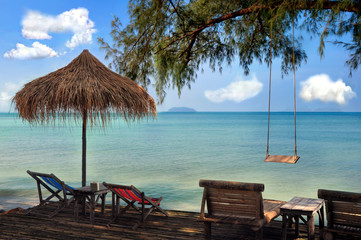 Beach with swing and sunbeds