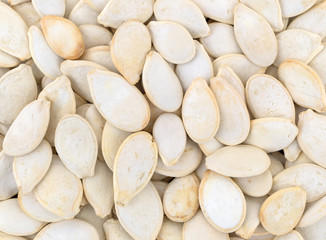 Fototapeta na wymiar Close view of roasted and salted pumpkin seeds.
