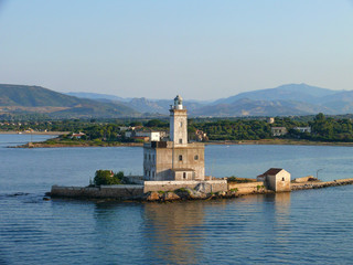 Fototapeta na wymiar Lighthouse in Olbia harbour, Sardinia, Italy