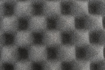 Top close view of black eggshell foam polyurethane packing material.