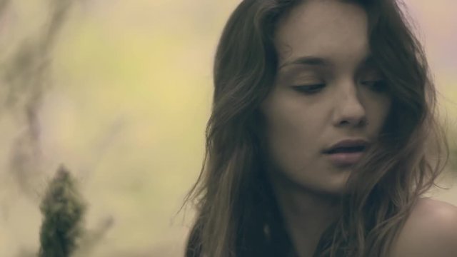 Closeup Of Young Woman's Face As She Looks Around Forest (Slow Motion)