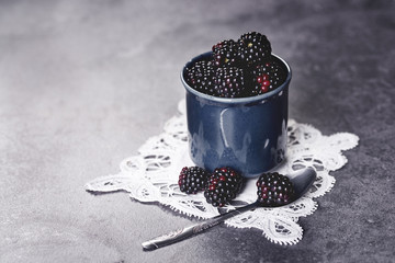 Fototapeta na wymiar Delicious blackberries in the retro cup