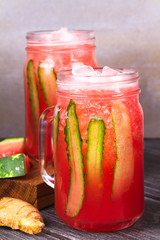 Watermelon, cucumber and ginger cocktail in jars