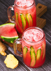 Watermelon, cucumber and ginger cocktail in jars
