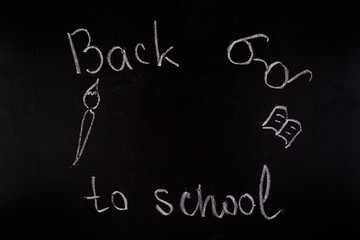 Back to school concept. White chalk on blackboard