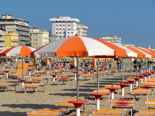 Rimini - Orange umbrellas and sunbeds