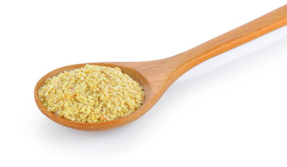 Wheat germ in wood spoon on white background