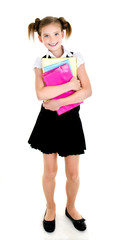 Portrait of smiling happy school girl child with books
