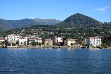 Fototapeta na wymiar Holidays at Lake Maggiore in summer, view to Intra Verbania from the car ferry, Italy