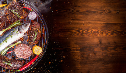 Barbecue grill with beef steaks, close-up.