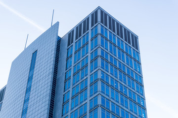 View of a modern glass skyscraper buildings around